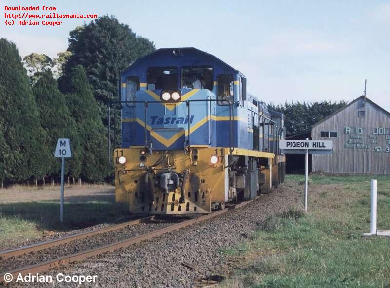 1107 leads a loaded Primrose concentrates train through Pigeon Hill. July 1999