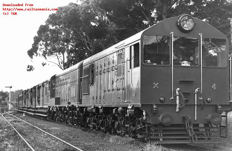 New locomotives X4 and X5 on a test run from Launceston to Western Junction pause at Relbia. The train comprises of three brake vans and two carriages, November 1950