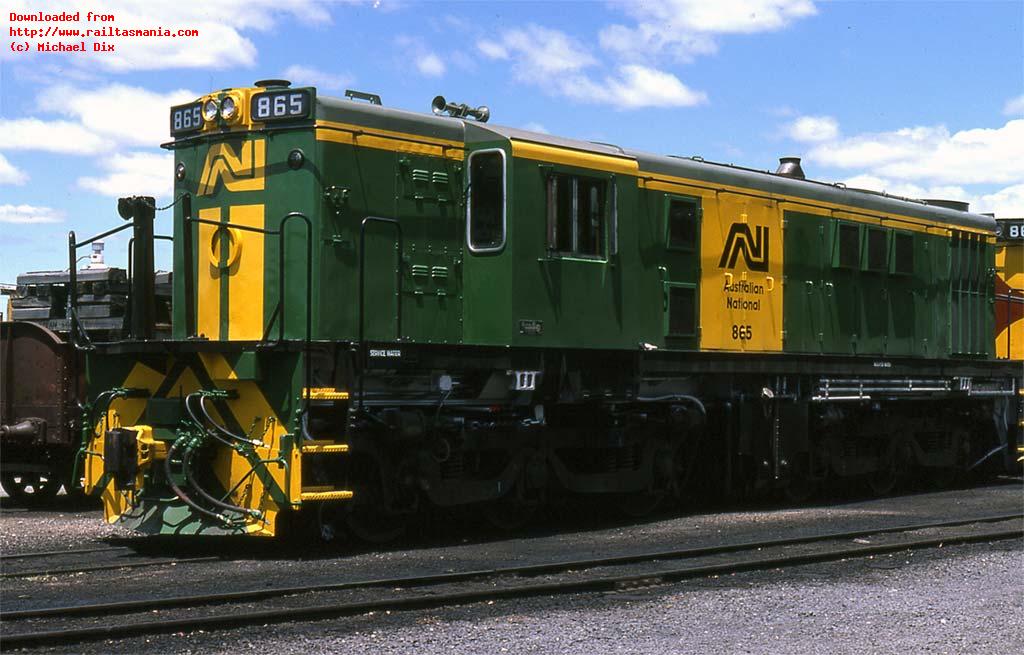 Freshly repainted 865 rests in the Launceston workshops area, December 1981. This loco differed from many of the other 830 class in the lack of a cab side number and black rather than yellow bogies