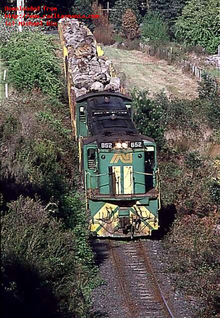 852 and 875 haul a log train near National Park. October 1991