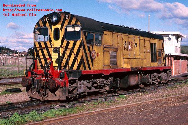 Wearing a grubby version of the old TGR yellow, vacuum braked loco Y6 stands at Devonport during 1991