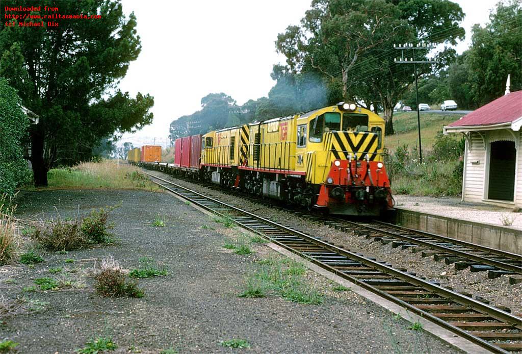 Z4 and another Z class loco haul a northbound container train through the disused station area at Cornelian Bay in January 1979
