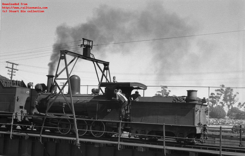 South Australian Railways locomotive Y97 at the Peterborough, early 1970s. This locomotive was another standard Beyer Peacock locomotive, and was constructed shortly before C12, although the tender shown here was originally fitted to a smaller class and was fitted to this locomotive in later years to allow it to fit with other vehicles on the turntable