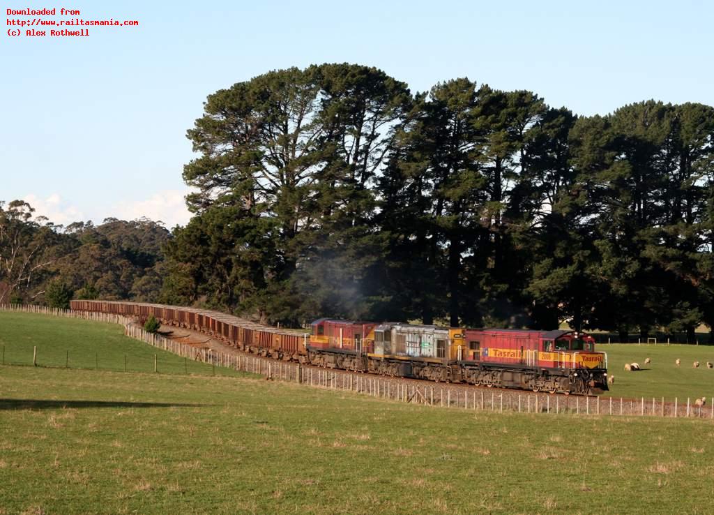 It is now over five years since the last vacuum-braked concentrate train ran on the former Emu Bay Railway in March 2002. The concentrate trains are now normally the domain of GM-powered locos, such as DQ2008-QR2062-DQ2007 photographed hauling southbound train 277 between Burnie and Ridgley on 13 August 2007