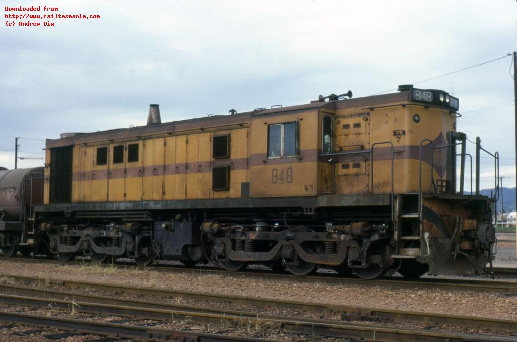 Standard gauge locomotive 848 shunts wagons in the yard at Port Pirie, South Australia; August 1984