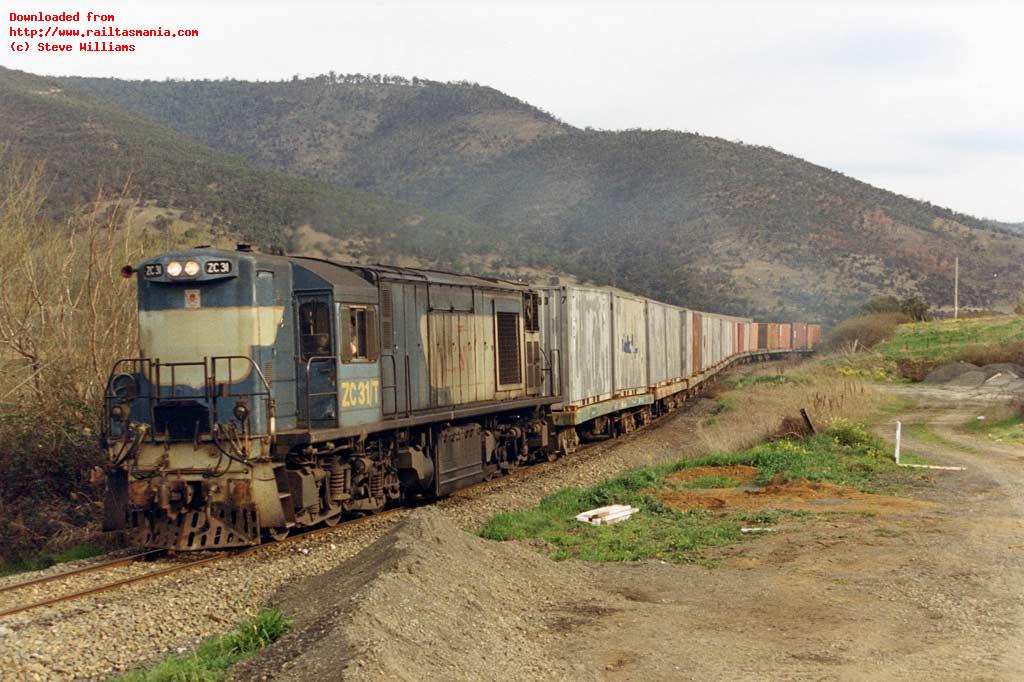 ZC31 hauls the Hobart bound number 111 paper train past the site of Dromedary station in September 1989