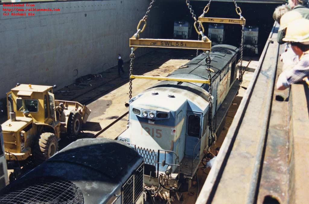 1315 is prepared for lifting from the hull of the <i>Condock II</i>. Fifteen locomotives were delivered in each of three shipments in October 1988