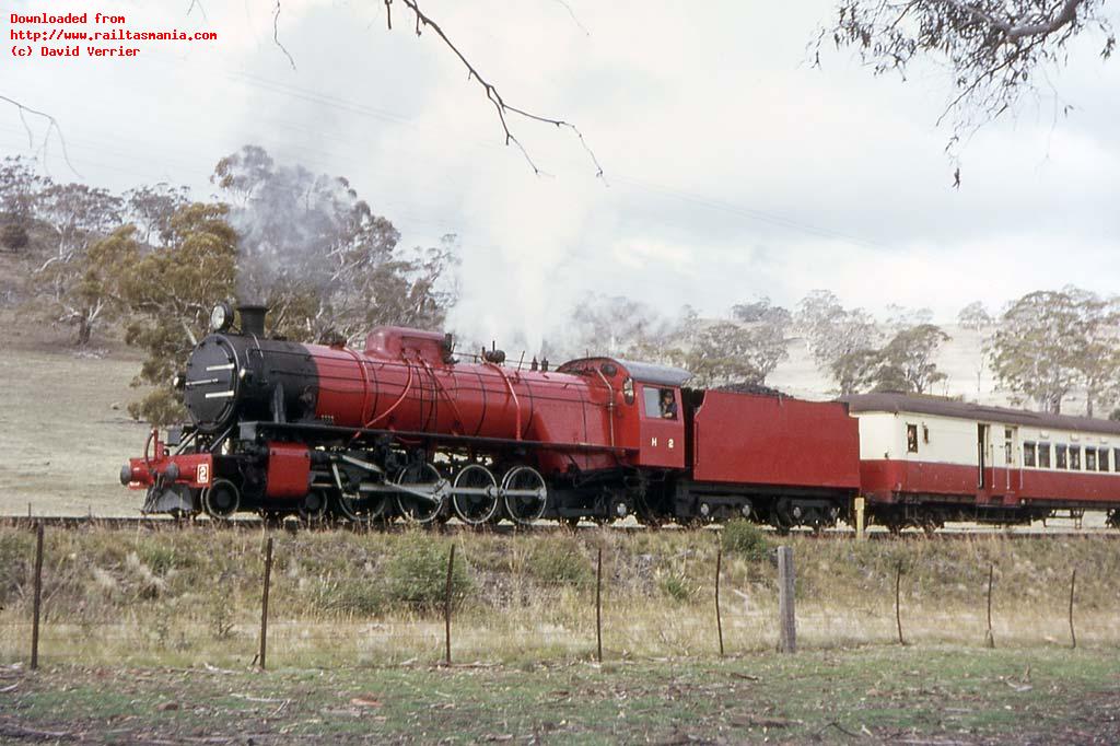 H2 conducts a photo stop near Llewellyn whilst hauling an ARHS excursion train to St Marys in April 1965