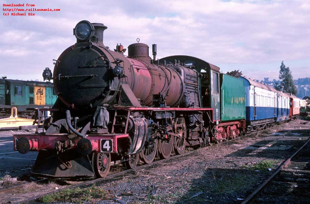 With the arrival of 45 diesel locos from Queensland, space became tight at Launceston Workshops. After having been stored in the round house at Launceston for many years, partly restored M4 & other stock wait in the goods yards at Launceston before being transferred to Devonport, and the Don River Railway. June 1989