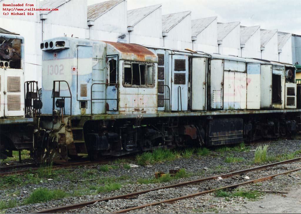 Whilst some stored locos had plated up cabs and secured engine bays, by October 1996 (just a few months prior to scrapping), Queensland Railways 1302 sits at Mowbray near Launceston having been ratted by workshops staff, preservation groups restoring Y locomotives, and the vandals.