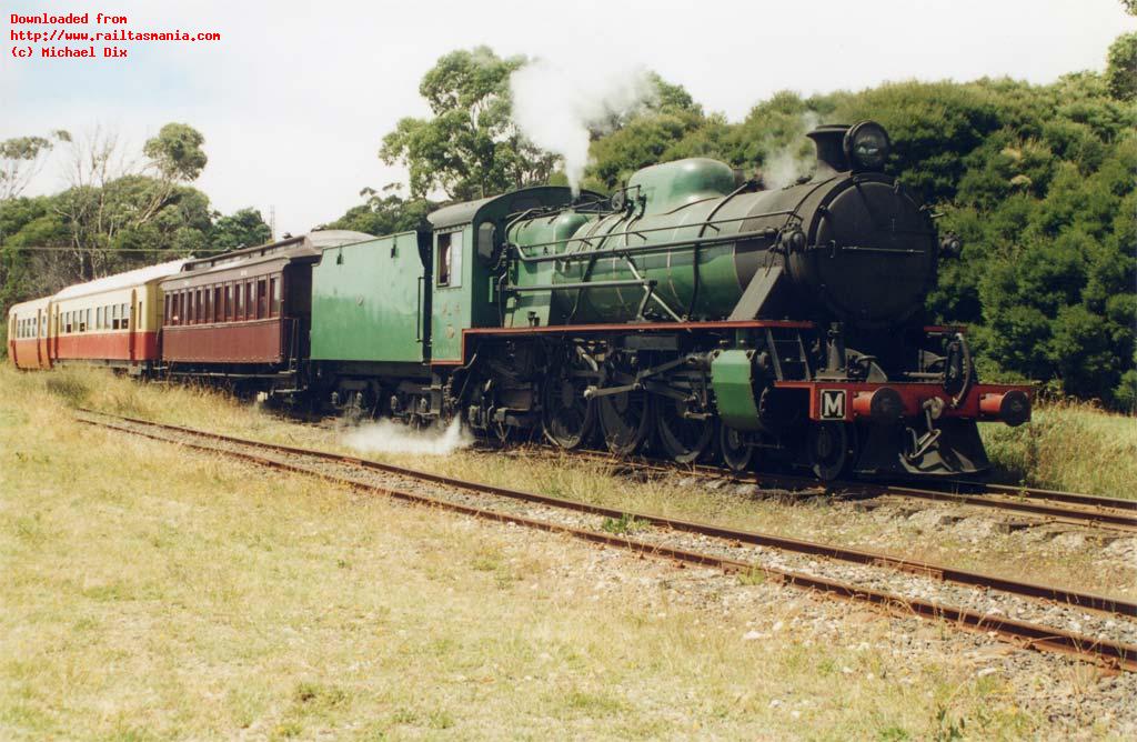 M4 and train of assorted historical carriages waits for departure at Coles Beach before returning to Don. February 1997