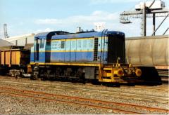 In January 1999, Number 21 shunts yet another rake of concentrate wagons through the rotary tippler 