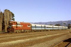 DA1455 leads a passenger train though Woodville, New Zealand; June 1974